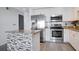 Kitchen boasts stainless steel appliances and granite island at 4221 W Spruce St # 1407, Tampa, FL 33607