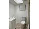 Clean bathroom with toilet, sink, and shower at 732 Riverside Dr, Tarpon Springs, FL 34689