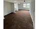 Large carpeted bedroom with ample natural light at 732 Riverside Dr, Tarpon Springs, FL 34689