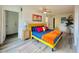 Bright bedroom with a yellow bed frame and colorful decor at 732 Riverside Dr, Tarpon Springs, FL 34689