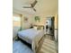 Main bedroom with king-size bed and access to another room at 732 Riverside Dr, Tarpon Springs, FL 34689