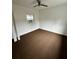 Simple bedroom with brown carpet and window at 732 Riverside Dr, Tarpon Springs, FL 34689