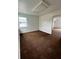 Empty spare bedroom with brown carpet and window at 732 Riverside Dr, Tarpon Springs, FL 34689