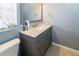 Bathroom with vanity, sink, and marble countertop at 3534 Player Dr, New Port Richey, FL 34655