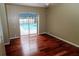 Bedroom with hardwood floors and pool view at 3534 Player Dr, New Port Richey, FL 34655