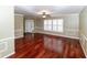 Living room with hardwood floors and white shutters at 3534 Player Dr, New Port Richey, FL 34655