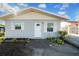 Charming bungalow with gray exterior, white trim, and shutters at 510 S Disston Ave, Tarpon Springs, FL 34689