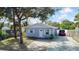 Cute bungalow with a gray exterior, fenced yard, and driveway at 510 S Disston Ave, Tarpon Springs, FL 34689