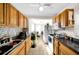 Well-lit kitchen with wood cabinets and ample counter space at 510 S Disston Ave, Tarpon Springs, FL 34689