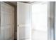 View of a door leading into a small, empty basement room at 2216 52Nd N Ave, St Petersburg, FL 33714