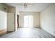 Bedroom with wood-look floors, sliding door to patio, and ceiling fan at 2216 52Nd N Ave, St Petersburg, FL 33714