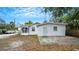 White house exterior with detached garage and spacious yard at 2216 52Nd N Ave, St Petersburg, FL 33714