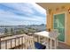 Balcony seating with city view and a table for outdoor enjoyment at 750 N Tamiami Trl # 814, Sarasota, FL 34236