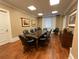 Elegant conference room, features a large table and leather chairs at 750 N Tamiami Trl # 814, Sarasota, FL 34236