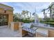 Outdoor grilling area with a stainless steel grill and water feature for outdoor cooking and entertaining at 750 N Tamiami Trl # 814, Sarasota, FL 34236