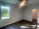 Bedroom with ceiling fan, hardwood floors, window, and closet at 1401 Newton St, Port Charlotte, FL 33952