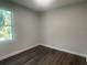 Simple bedroom with a window and wood-look floors at 1401 Newton St, Port Charlotte, FL 33952