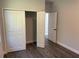 Bedroom with double-door closet and access to another room at 1401 Newton St, Port Charlotte, FL 33952