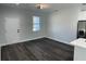 Bright dining area with hardwood floors and access to kitchen at 1401 Newton St, Port Charlotte, FL 33952