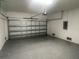 Garage with automatic door opener and epoxy flooring at 1401 Newton St, Port Charlotte, FL 33952