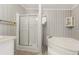 Bathroom with corner tub and glass shower at 3105 Beaver Creek Dr, Wesley Chapel, FL 33543