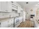 White kitchen with ample cabinetry and an island at 3105 Beaver Creek Dr, Wesley Chapel, FL 33543