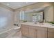 Light-filled bathroom with updated vanity, bathtub, and tile at 3770 Torrey Pines Blvd, Sarasota, FL 34238