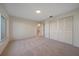 Bedroom with large window, closet, and carpet at 3770 Torrey Pines Blvd, Sarasota, FL 34238