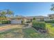 Single-story home with a two-car garage and well-manicured landscaping at 3770 Torrey Pines Blvd, Sarasota, FL 34238