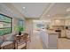 Kitchen with breakfast nook and view into the living area at 3770 Torrey Pines Blvd, Sarasota, FL 34238