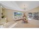 Light and airy living room showcasing sliding doors to the patio and pool area at 3770 Torrey Pines Blvd, Sarasota, FL 34238