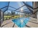 Relaxing screened-in pool and patio with stunning views at 3770 Torrey Pines Blvd, Sarasota, FL 34238