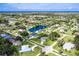 Bird's-eye view of the property, showcasing its canal-front location and neighborhood at 2917 Palm Dr, Punta Gorda, FL 33950