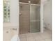 Large bathroom with shower and tub, tile floors at 2917 Palm Dr, Punta Gorda, FL 33950