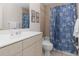 Bathroom with a shower/tub combo and seashell-themed decor at 2917 Palm Dr, Punta Gorda, FL 33950