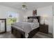 Cozy bedroom with queen bed, ceiling fan, and wood floors at 2917 Palm Dr, Punta Gorda, FL 33950