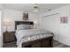 Bedroom with queen bed, ceiling fan, and double doors at 2917 Palm Dr, Punta Gorda, FL 33950