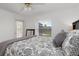 Guest bedroom with queen bed and backyard access at 2917 Palm Dr, Punta Gorda, FL 33950