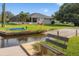 Wooden dock with bench overlooking the canal at 2917 Palm Dr, Punta Gorda, FL 33950