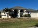 Single-story home with gray roof and attached garage at 2917 Palm Dr, Punta Gorda, FL 33950