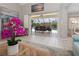 View from living room to the outdoor dining and pool area at 2917 Palm Dr, Punta Gorda, FL 33950
