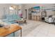 Bright and airy living room with teal sofas, a large TV and plenty of natural light at 2917 Palm Dr, Punta Gorda, FL 33950