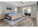 Main bedroom with king bed, access to lanai, and pool view at 2917 Palm Dr, Punta Gorda, FL 33950