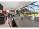 Outdoor patio with dining table and pool view at 2917 Palm Dr, Punta Gorda, FL 33950