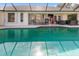 Relaxing pool area with covered patio and outdoor seating at 2917 Palm Dr, Punta Gorda, FL 33950