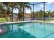 Inviting screened-in pool with canal views and lush landscaping at 2917 Palm Dr, Punta Gorda, FL 33950