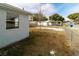 Backyard with chain link fence, shed, and small tree at 4215 Pecos Dr, New Port Richey, FL 34653