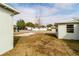 Backyard with a small tree and view of street at 4215 Pecos Dr, New Port Richey, FL 34653