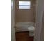 Clean bathroom with a tub and updated flooring at 4215 Pecos Dr, New Port Richey, FL 34653