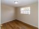 Bedroom with wood-look floors and a window at 4215 Pecos Dr, New Port Richey, FL 34653